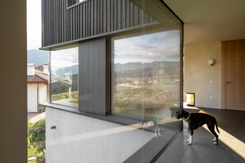 A Bold Black House Rises From a Landscape of Orchards