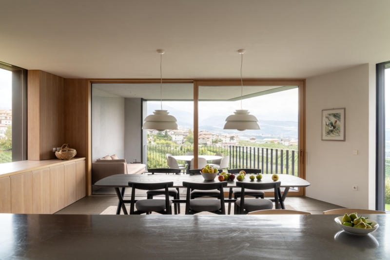 A Bold Black House Rises From a Landscape of Orchards