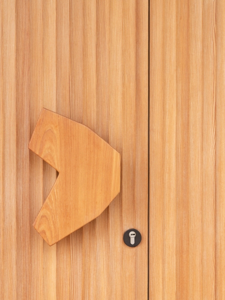 A Bold Black House Rises From a Landscape of Orchards