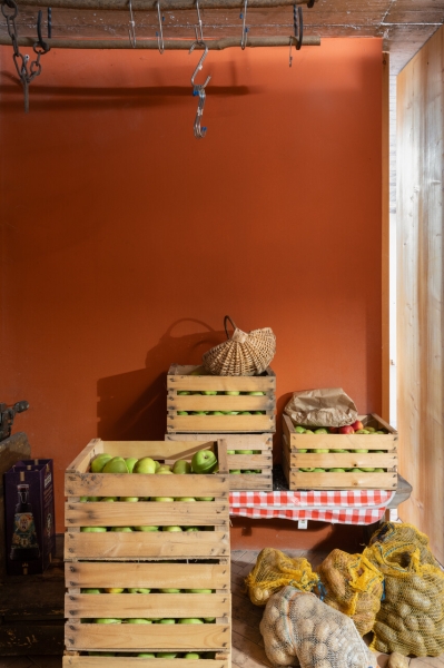 A Bold Black House Rises From a Landscape of Orchards