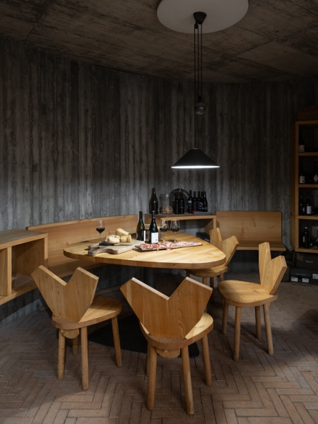 A Bold Black House Rises From a Landscape of Orchards