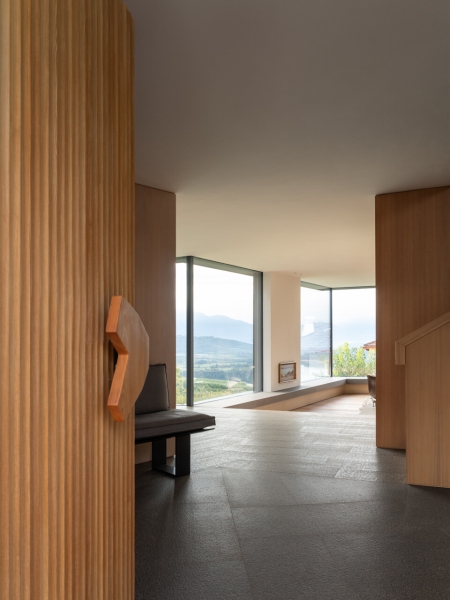 A Bold Black House Rises From a Landscape of Orchards