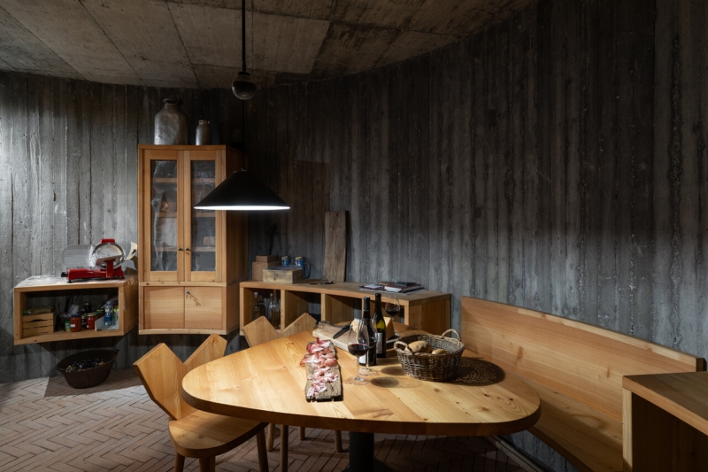 A Bold Black House Rises From a Landscape of Orchards