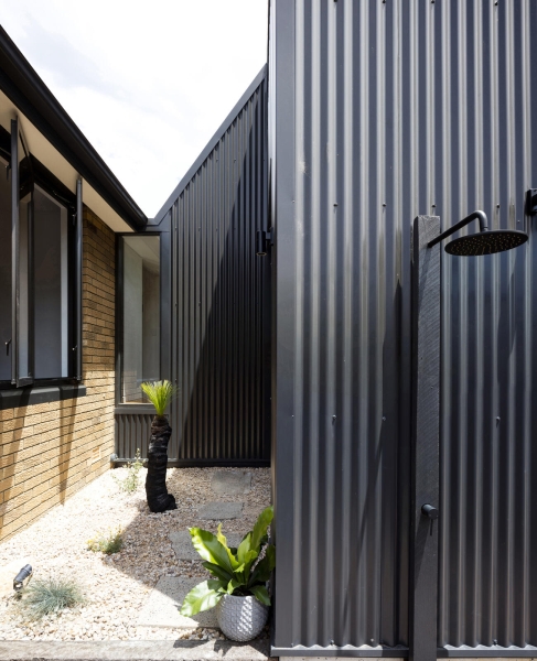 How a Black Metal Extension Turned a 1960s Brick House Into a Light-Filled Modern Home