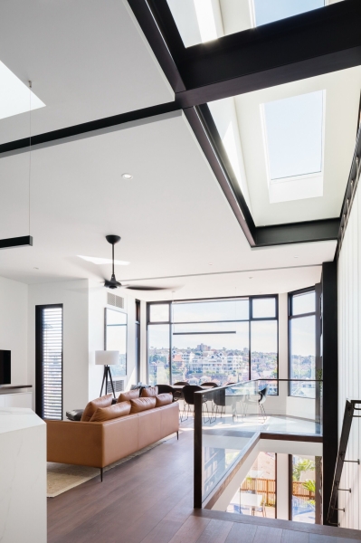 Inside a Home Where Glass Floors Let Light Travel Between Levels