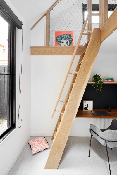 A Bookshelf Wall, a Courtyard and a Surprise Loft Transform this Home