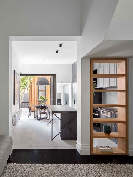 A Bookshelf Wall, a Courtyard and a Surprise Loft Transform this Home