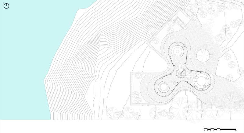 An Amoeba-Shaped Glass Home Perched Above the Chilean Coast