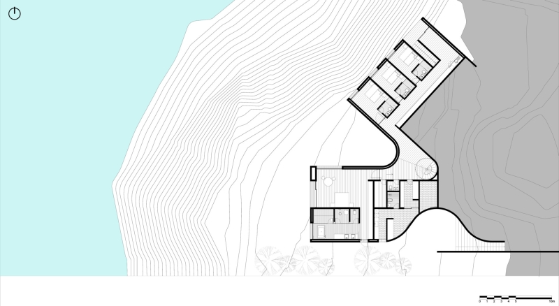 An Amoeba-Shaped Glass Home Perched Above the Chilean Coast