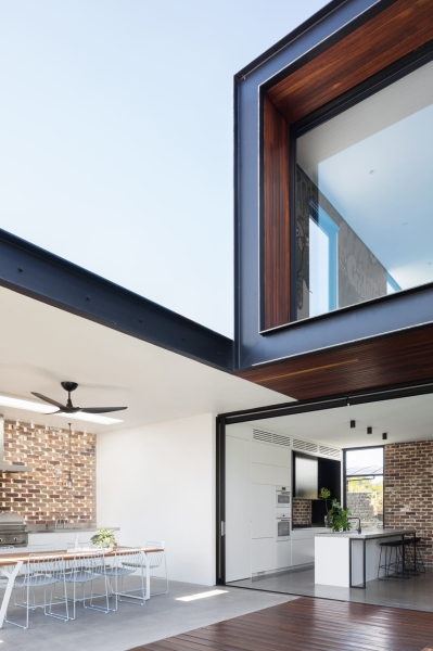 Floor-to-Ceiling Windows, Recycled Brick and a Pool That Ties It All Together