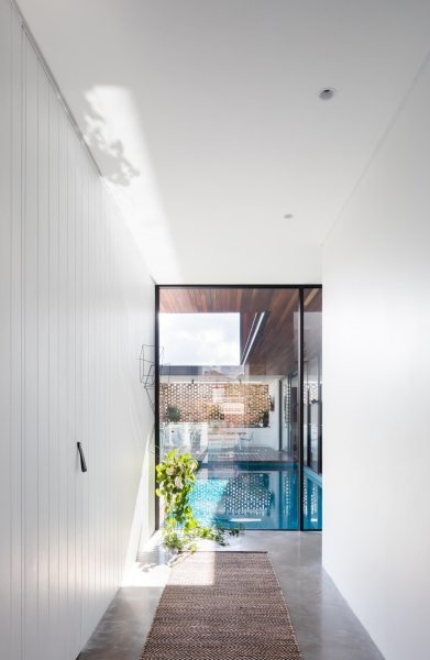 Floor-to-Ceiling Windows, Recycled Brick and a Pool That Ties It All Together