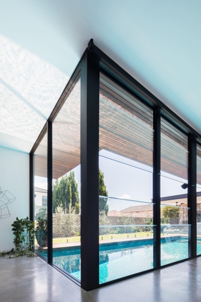 Floor-to-Ceiling Windows, Recycled Brick and a Pool That Ties It All Together