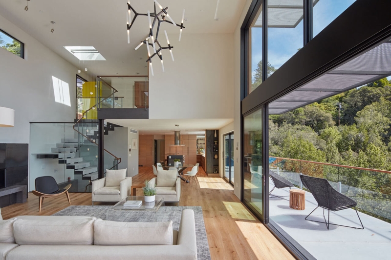 The Hillside House Wrapped in Rusted Steel with a Bright Yellow Surprise