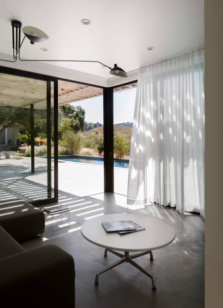 The Pool House That Uses Old Vineyard Stakes to Create Privacy and Views