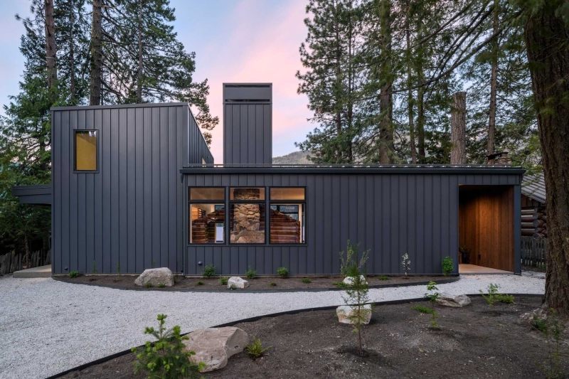 A Century-Old Log Cabin Becomes the Living Room of a New Lake House