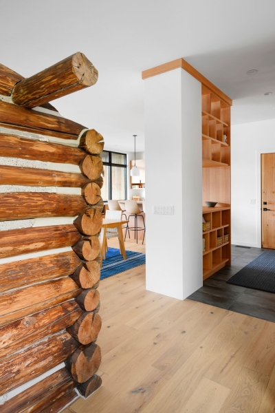 A Century-Old Log Cabin Becomes the Living Room of a New Lake House