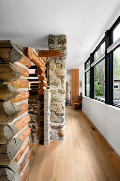 A Century-Old Log Cabin Becomes the Living Room of a New Lake House