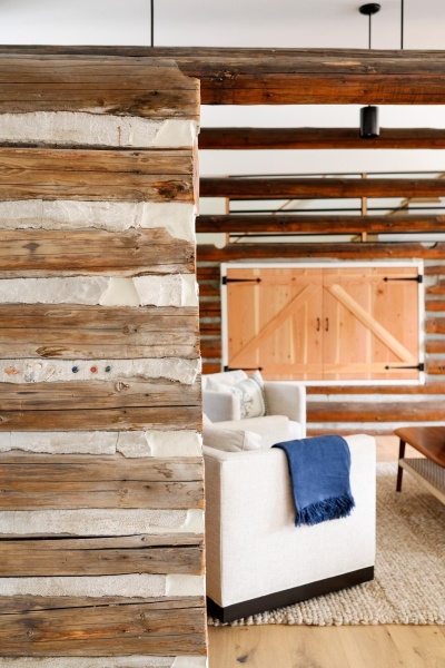 A Century-Old Log Cabin Becomes the Living Room of a New Lake House
