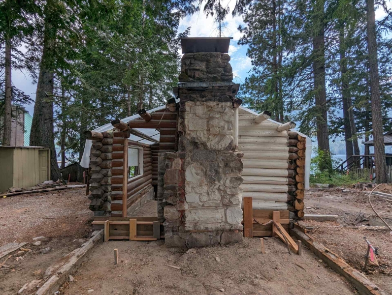 A Century-Old Log Cabin Becomes the Living Room of a New Lake House