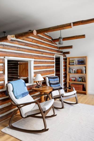 A Century-Old Log Cabin Becomes the Living Room of a New Lake House