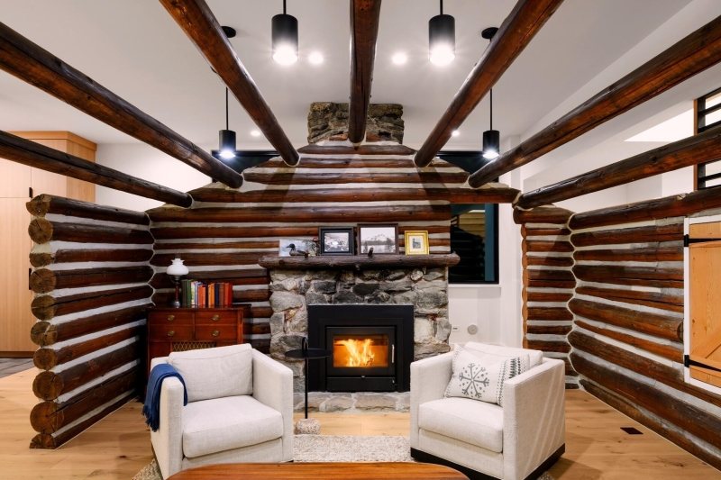 A Century-Old Log Cabin Becomes the Living Room of a New Lake House