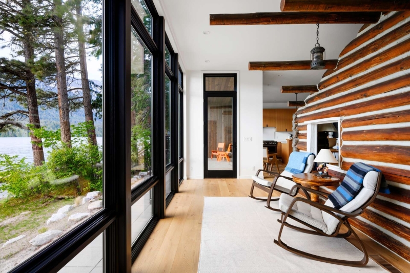 A Century-Old Log Cabin Becomes the Living Room of a New Lake House