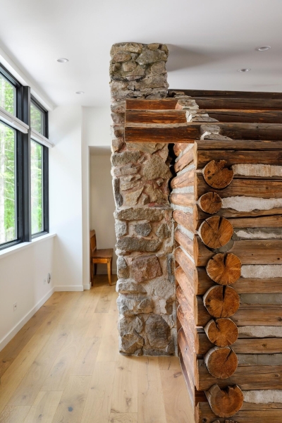 A Century-Old Log Cabin Becomes the Living Room of a New Lake House