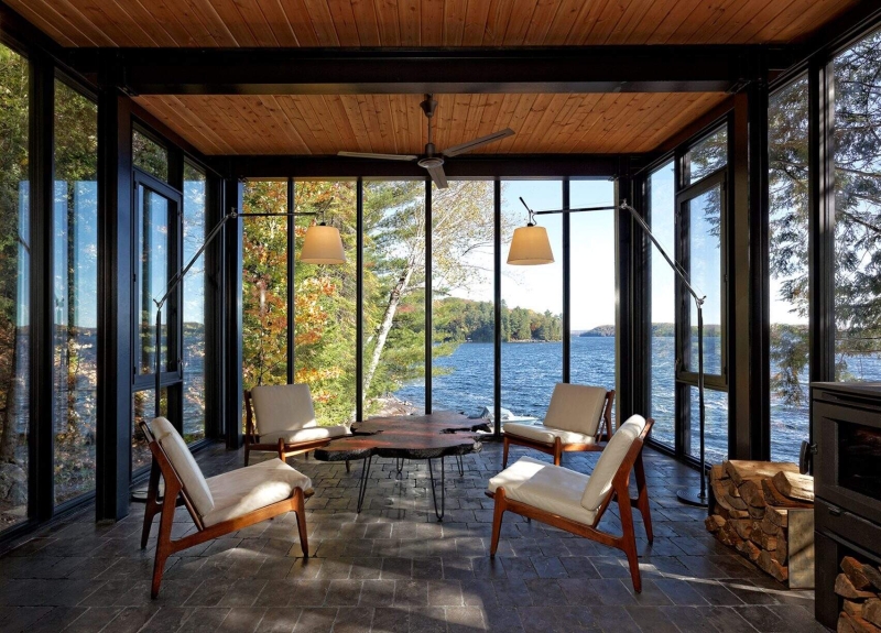 A Modern Boathouse Built by Hand on a Canadian Lake Includes a Living Space