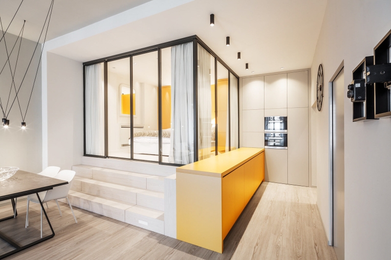 A Small Apartment With Big Ideas, Including a Hidden Kitchen and Raised Bedroom