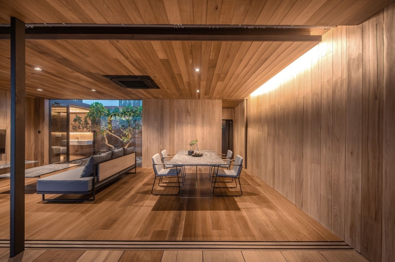 From Water Tanks to a Warm Wooden Home on a Bangkok Rooftop