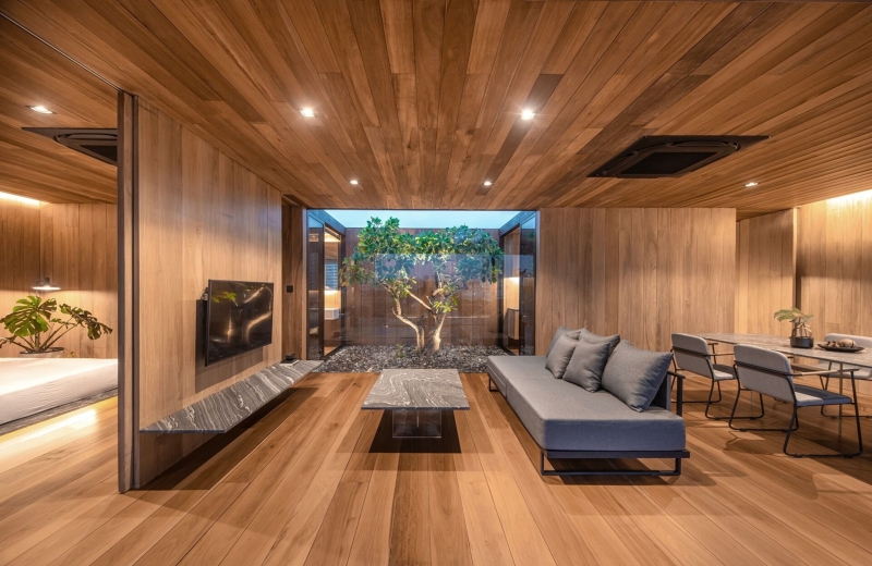 From Water Tanks to a Warm Wooden Home on a Bangkok Rooftop