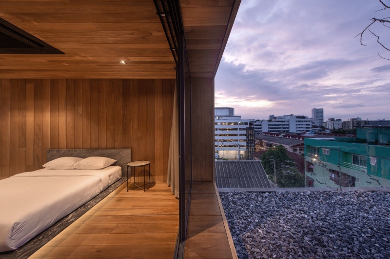 From Water Tanks to a Warm Wooden Home on a Bangkok Rooftop