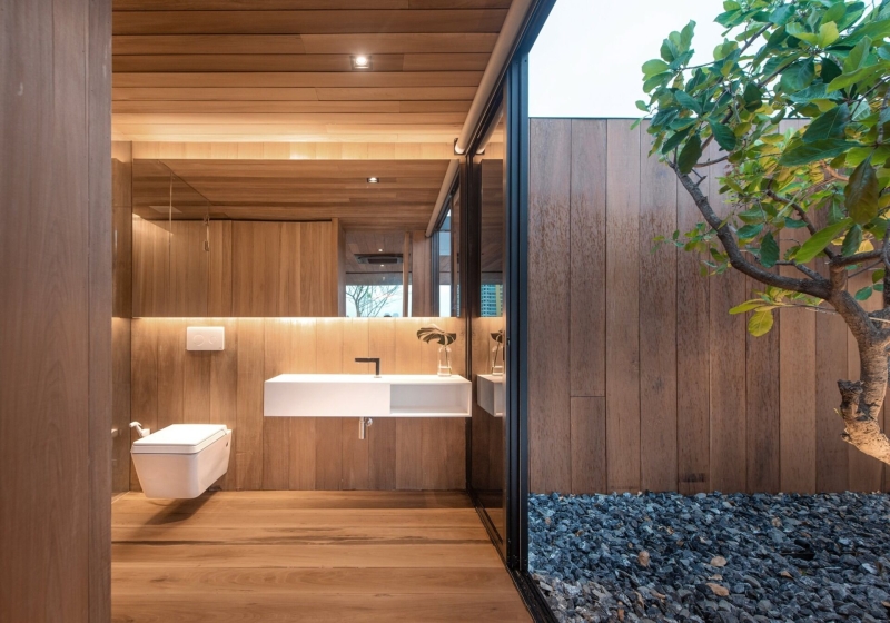 From Water Tanks to a Warm Wooden Home on a Bangkok Rooftop